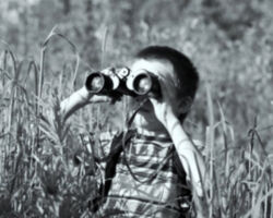 Temple with his first pair of binoculars. 1955. Photo by J. Temple.