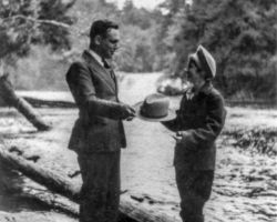 Aroline being presented with an honorary forest service hat.