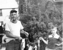 Johnson with son Douglas after a fishing expedition. 1957. Photo courtesy of Douglas Johnson.