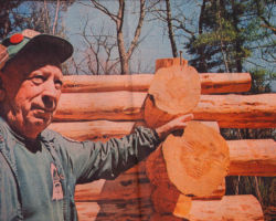 Leo Nickasch at cabin being built to his honor his friend, Ray Feit, at the Central Wisconsin Environmental Station in Amherst Junction, WI. 1986. Photo by Bob Boeten.