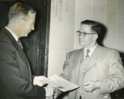 Fred Schmeeckle receiving conservation award. 1952.