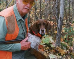 Johnson with his German Shorthaired Pointer hunting dog, Brighton. 1998. Photo by Tim Eisele.