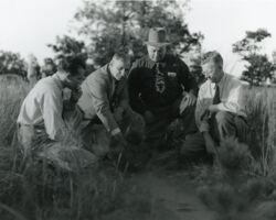 L-R: Fred Dalms, Landcaster Grant County Agent; Fred Trenk, UW Extension Forester; Al Kratochwil, WI River Valley Reforestation Project; Carl Haas, landowner. 1951. Photo courtesy of WI Department of Natural Resources.