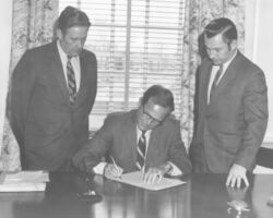 Governor of Delaware, Russell Peterson signing SB450. 1970. Photo courtesy of Deleware Public Archives.