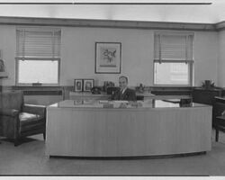 Guido Rarh at desk at Rahr Malting Co. in Manitowoc, WI. 1945. (Photo by Gottscho-Schleisner, Inc.)