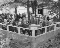 Guido Rahr, chairman of the Conservation Commission, addressing group at formal dedication ceremonies for the new hatchery building at Woodruff. 1964. (Photo by Staber W. Reese. Courtesy of UW-Madison Digital Archives.)