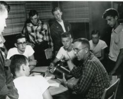 Robert Ellarson at the Eau Claire School Forest leading a birdhouse building project. 1957. Photo courtesy of Ellerson Family Collection.
