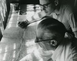 Leslie Woerpel and Ray Larson looking at maps in the Wisconsin Wildlife Federation office.