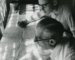 Leslie Woerpel and Ray Larson looking at maps in the Wisconsin Wildlife Federation office.
