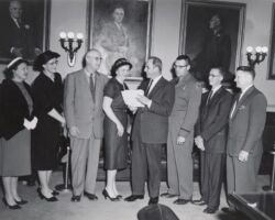 A group of state employees receiving awards from Governor Gaylord Nelson. Conservation warden David Hammes is third from right. 1959. (Photo by Dean Tvedt. Courtesy of UW-Madison Digital Archives.)