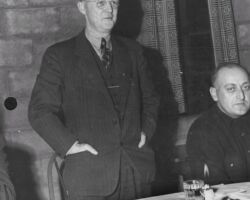 Ernest Swift at Haskel Noyes annual warden award ceremony at Sayner town hall. Warden D. W. Waggoner is at right. 1947. Photo by Staber W. Reese. Courtesty of UW-Madison Digital Archives.