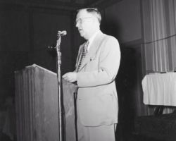 Ernest F Swift, director of the Wisconsin Conservation Department, speaking at the Wisconsin Conservation Congress meeting. 1953. Photo by Dean Tvedt. Courtesty of UW-Madison Digital Archives.