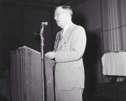 Ernest F Swift, director of the Wisconsin Conservation Department, speaking at the Wisconsin Conservation Congress meeting. 1953. Photo by Dean Tvedt. Courtesty of UW-Madison Digital Archives.