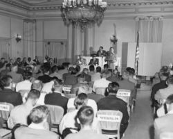 Wisconsin Conservation Department director Ernest F. Swift giving address at Wisconsin Conservation Congress meeting. 1952. Photo by Dean Tvedt. Courtesty of UW-Madison Digital Archives.