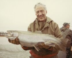 Governor Warren P. Knowles holding rainbow trout removed from pond net for spawning purposes. 1970. Photo by Staber W. Reese. Courtesy of UW-Madision Digital Archives.