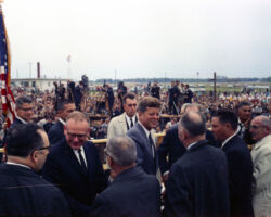 Martin Hanson served as tour guide when Senator Gaylord Nelson (WCHF Inductee) brought President John F. Kennedy to the Apostle Islands in 1963. Hanson is pictured on the far right of the image. Photo courtesy of Jeffrey Stoddard. Photograph by Cecil Stoughton in the John F. Kennedy Presidential Library and Museum, Boston.