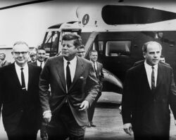 Martin Hanson (back row, far right) served as Presidential Tour Guide for Governor John Reynolds, John F. Kennedy and Gaylord Nelson's tour of the Apostle Islands in 1963. Behind JFK is Interior Secretary Stewart Udall (on JFK's right) and Secretary of Agriculture Orville Freeman (on JFK's left). Nelson's goal was to bring the Apostle Islands into the National Park Service. Photo courtesy of Jeffrey Stoddard.