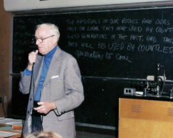 Hickey delivering his last lecture at the Dept. of Wildlife Ecology, Univ. of Wisconsin-Madison, Madison, WI. 1976. One of his favorite quotes is written on the chalk board behind him; one word is accidentally left out, but it is still a great quote to live by. (Photo courtesy of Susi Hickey Nehls.)
