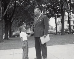 Gordon congratulating a young boy on receiving an award. It could have been a conservation award, or safety award, or 4-H award or good citizen award. Gordon promoted many youth awards. 1950. (Photo courtesy of Bubolz Family.)