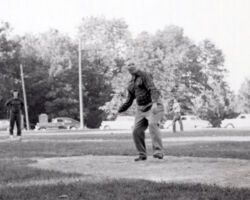 Gordon Bubuolz pitching at a company picnic. Employees were invited to a local park to celebrate company founder, Julius Bubolz's birthday each year. (Photo courtesy of SECURA Insurance.)