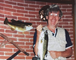 Arlen enjoys fishing and teaching his grandchildren to fish. He usually throws them back to "grow a little more." Pictured here at his cabin in Lake Five in Clam Lake, WI. Circa 1980s. (Photo courtesy of Christenson Family.)