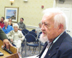 Eugene Roark honoring WCHF Inductee, Emily Earley, at a celebration in Madison. (Photo courtesy of the Wisconsin Conservation Hall of Fame.)