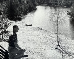 Stoddard looking at Wolf Creek from the porch of his cabin in Washburn County, WI. This wild space is called "Wolf Springs Forest." Circa late 1960s. (Photo courtesy of Stoddard Family.)