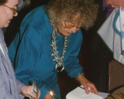 Fran Hamerstrom signing books at her Induction Ceremony. 1996 (Photo courtesy of Wisconsin Conservation Hall of Fame.)