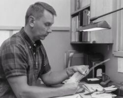 C. D. Besadny measuring wing feathers to determine the age of a juvenile pheasant. 1965. (Photo by Dean Tvedt. Courtesy of Wisconsin DNR and UW Madison Digital Archives.)