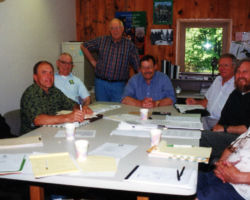 The WCHF Executive Committee from left to right: Bill Murphy, Ed Randall, Peter Muto, Bill Horvath, Earl Spangenberg, Bob Elliker, Joe Passineau, Gene Roark (WCHF Inductee). 2002. (Photo courtesy of the Wisconsin Conservation Hall of Fame.)