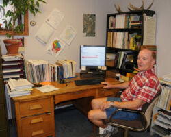 2020 Desk is where a lot of unit-specific deer population monitoring took place over the years and where harvest quota guidelines were prepared. (The War surplus desk moved from Ladysmith to Black River Falls Ranger Station, to Rhinelander Ranger Station, and lastly to the DNR regional office in Rhinelander seen here.) (Circa 2020, unknown source)
