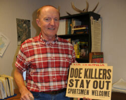 2020 Keith displaying one of many signs that were common in the north during the 1940s and early 1950s expressing anti-agency views when antlerless deer became legal to shoot by the Wisconsin Conservation Department. (Circa 2020, outdoor writer Pat Durkin photo).