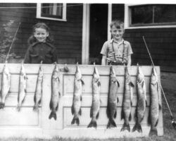 Keith’s classmate Sandy with Keith and fish caught from a Rusk County lake. They may have been about 5 yrs old in this photo. Keith’s family frequently rented a cabin on weekends at Chain Lake. Sandy's family joined them on this trip. The catch included those caught by their parents.
