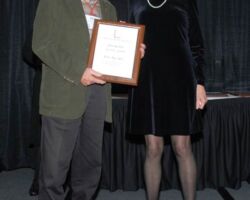 2013 The Wildlife Society President Winnie Kessler presented Keith with a Distinguished Service Award at a national meeting in 2013. (DNR photo)
