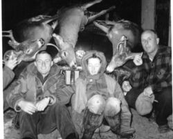 Keith's sister Lynette, his dad, and Keith after a successful opening day hunt north of Tony in 1959. Note family's '50 Buick Special buried in deer. Not all hunts were that successful!